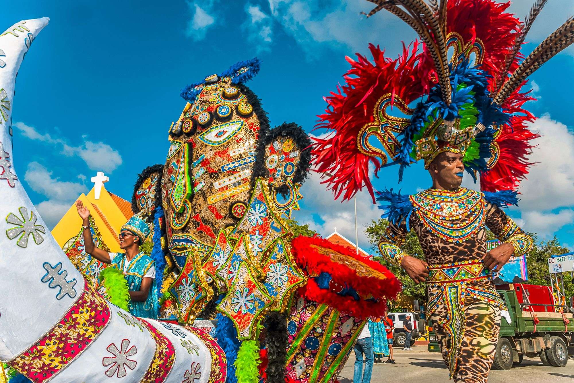 People in highly decorated brilliant costumes in festival for carnival in Curacao