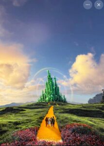 Emerald city with yellow brick road, characters walking.