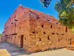 Historic desert brick building under blue sky.