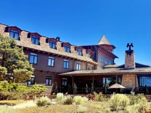 Historic lodge with wooden architecture under blue sky.