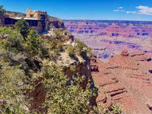 Historic building overlooking Grand Canyon landscape.