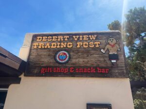 Desert View Trading Post sign with gift shop details.