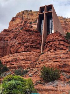 Chapel built into red rock cliffs, Sedona landscape.
