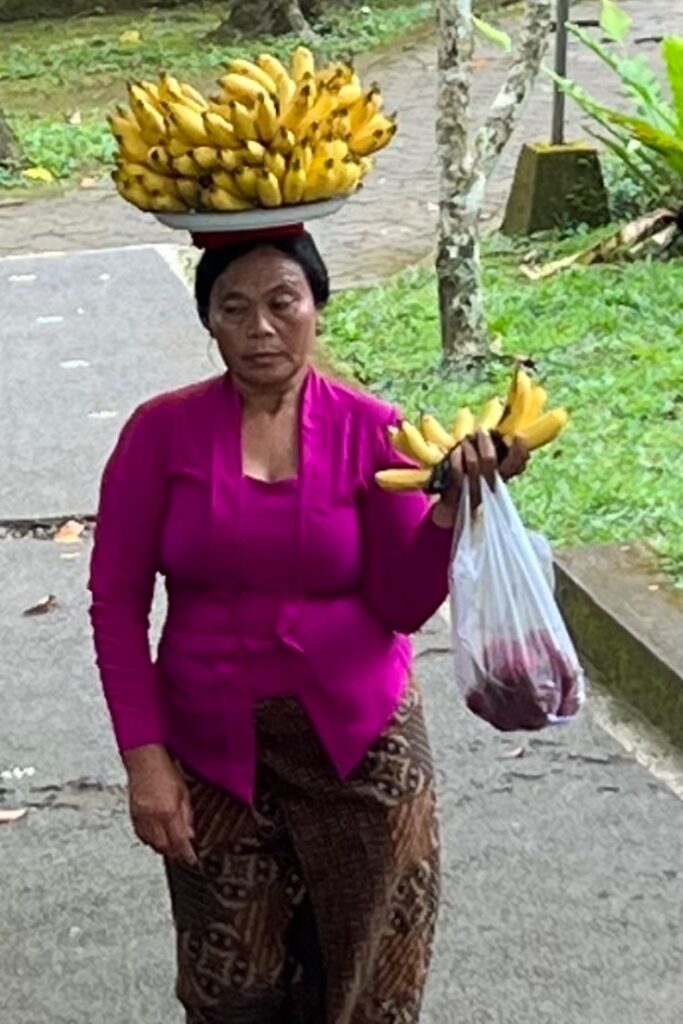 Best time to travel to Southeast Asia - lady with bananas