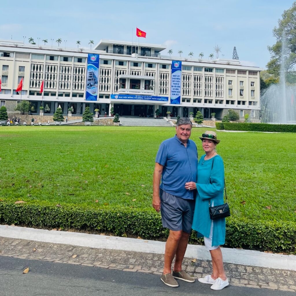 Best time to visit vietnam- Cos and Robin in front of the reunification center.