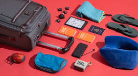 Travel essentials including luggage, books, and electronics.