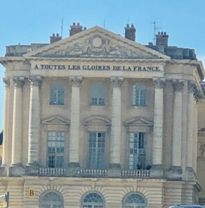 Classic French building with inscription on facade.