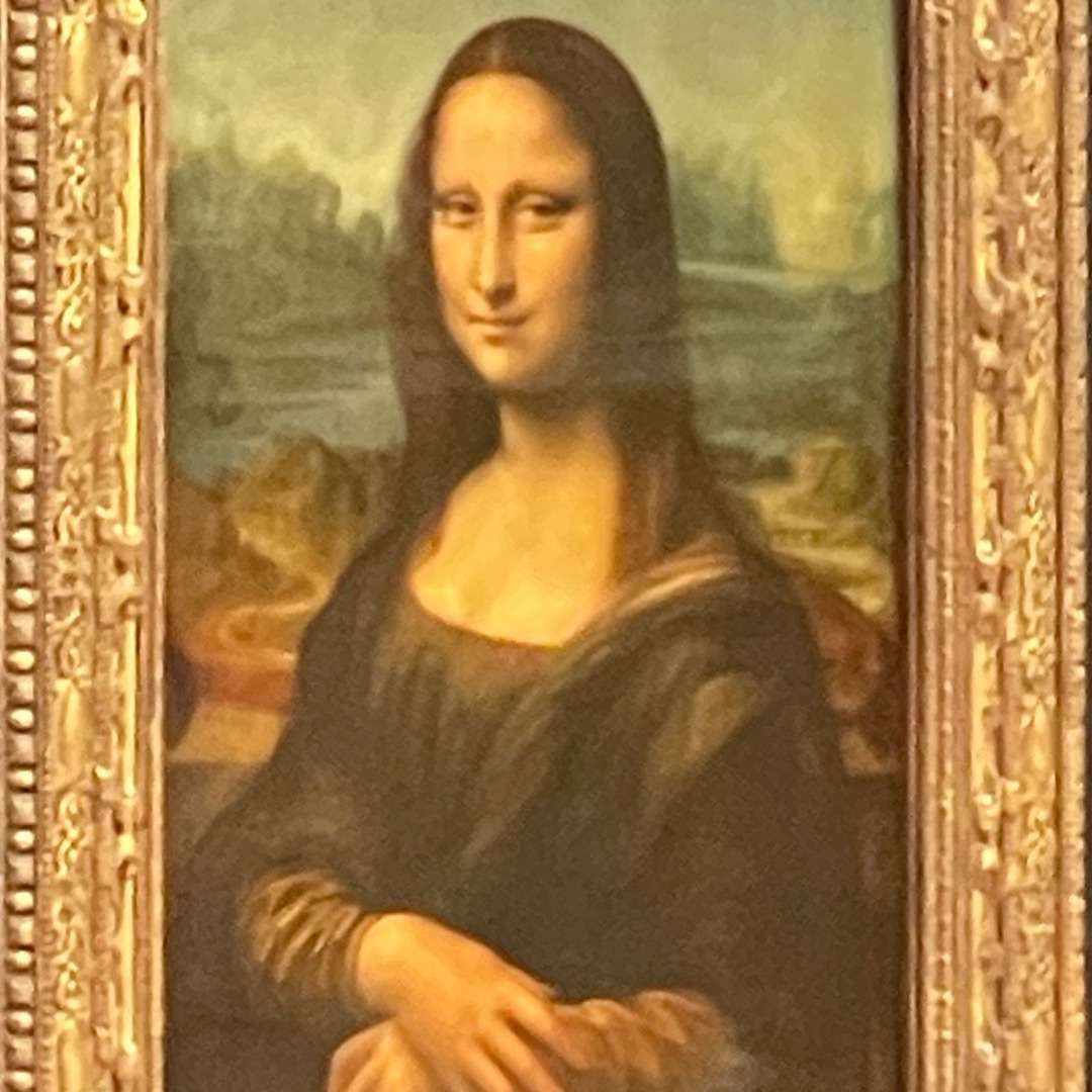 A portrait of Mona Lisa with her arms folded found at the Louvre Museum in Paris