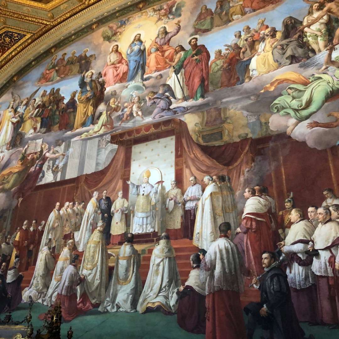 Huge mural with many figures with the bishop in the center at The Vatican Museum in Rome