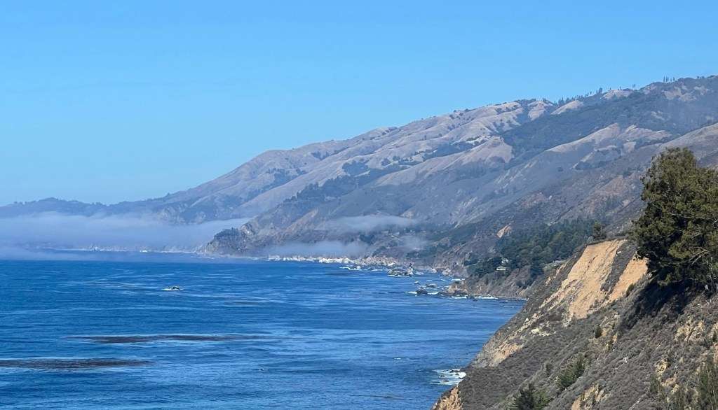 Fog lifting from shore at Big Sur - Road Trips from San Francisco