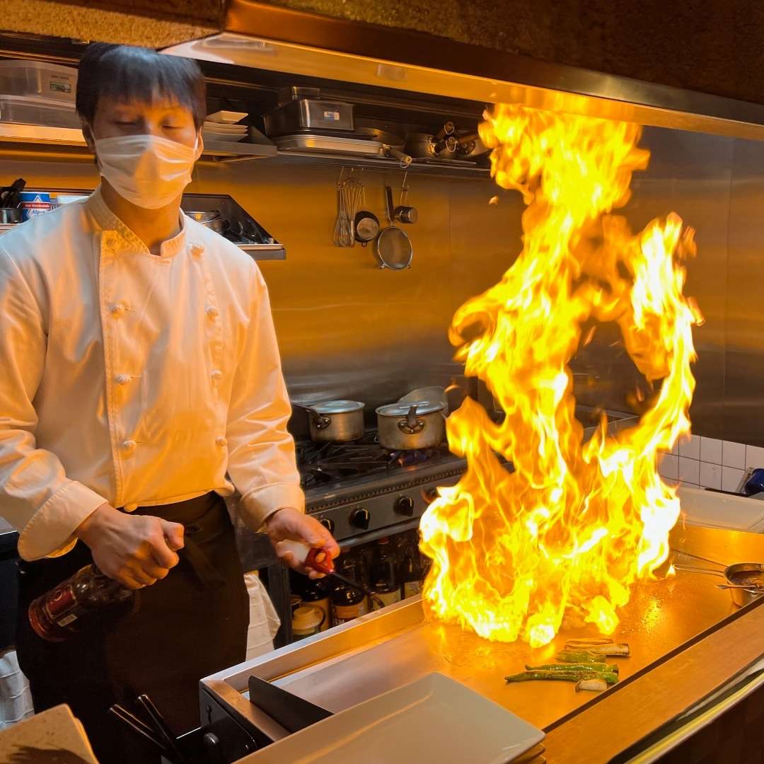 Chef cooking with flames