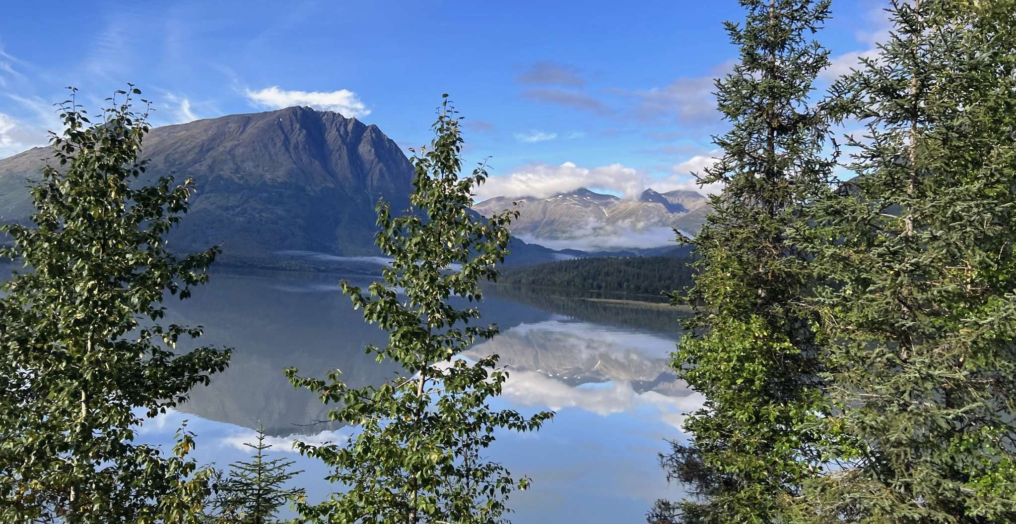 Mountains reflecting in river
