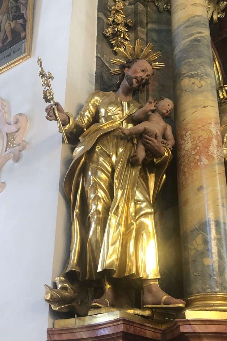 planning a trip to germany: Statue of man holding the baby Jesus