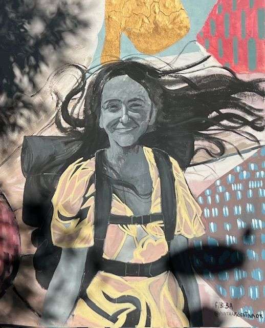 Beautiful young girl walking with backpack in Buenos Aires in Winter