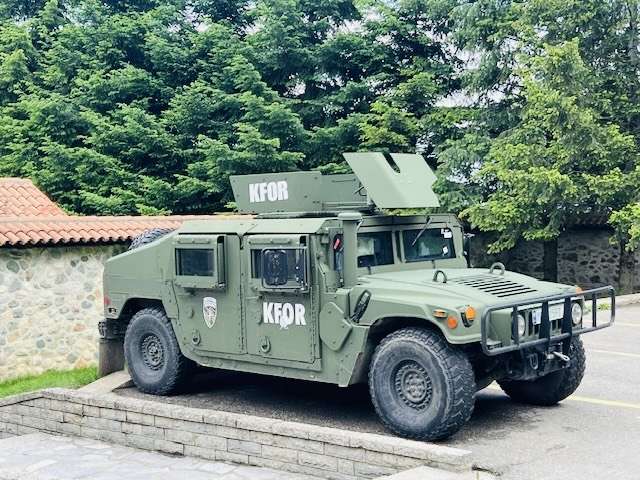 Consequences of War: NATO Jeep Parked at entrance to the Monastery