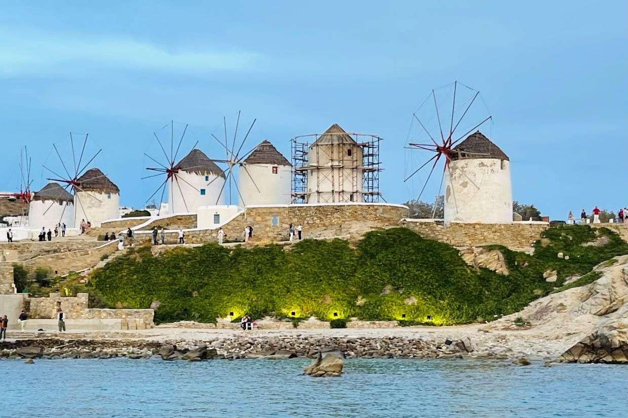Iconic windmills by the sea in Mykonos, Greece