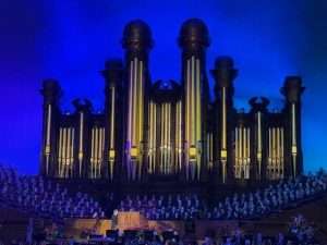 Grand organ with choir performance under blue lighting. Best things to Do in Park City Utah, head down to SLC