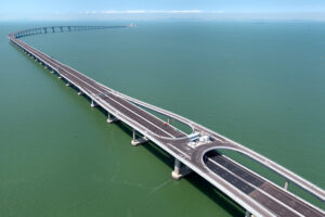 Long bridge over wide body of water.