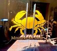 Ministry of Crab restaurant entrance with crab logo.