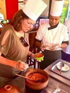 Robin with Chefs preparing a dish with spices in kitchen., Hambantota Harbor