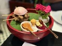 Gourmet food platter with sauces and flowers