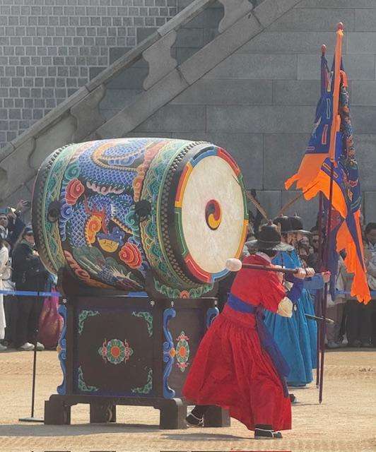 guards hitting drum