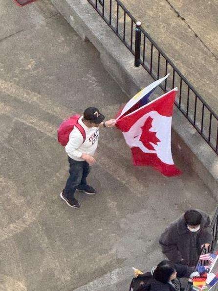 We felt a warm welcome in Southern Japan :Japanese person holding Canadian and Aamerican flag, things to do in Kagoshima