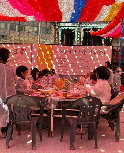 Visiting places in Seoul South Korea: people making lanterns