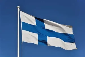 Finnish flag waving against clear blue sky Sweden vs Finland