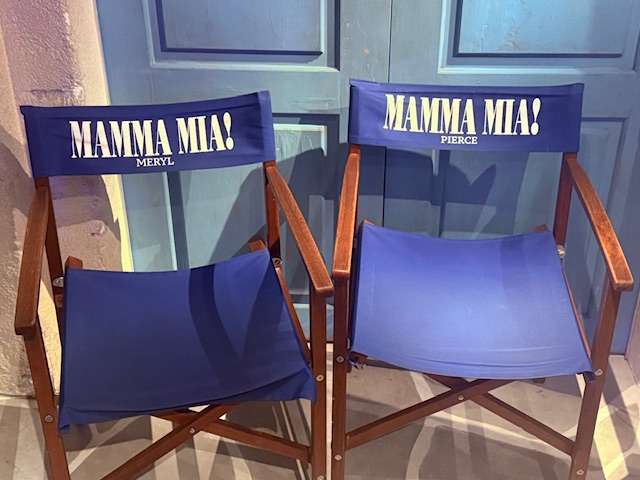 Two blue chairs with Mamma Mia! logos