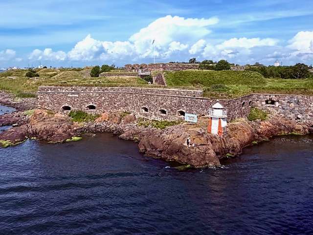 Historic fortress and lighthouse by the sea as traveling from Stockholm to Helsinki