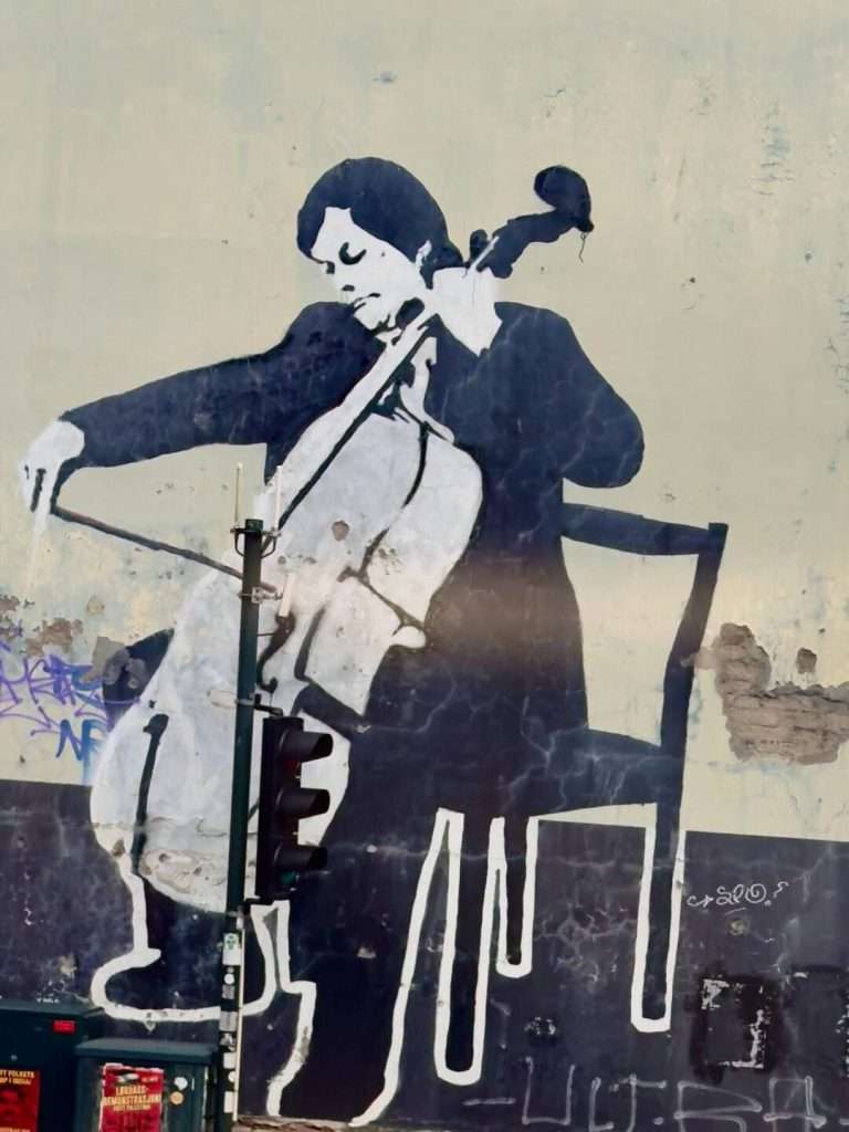 Street Art of man Playing Bass Fiddle