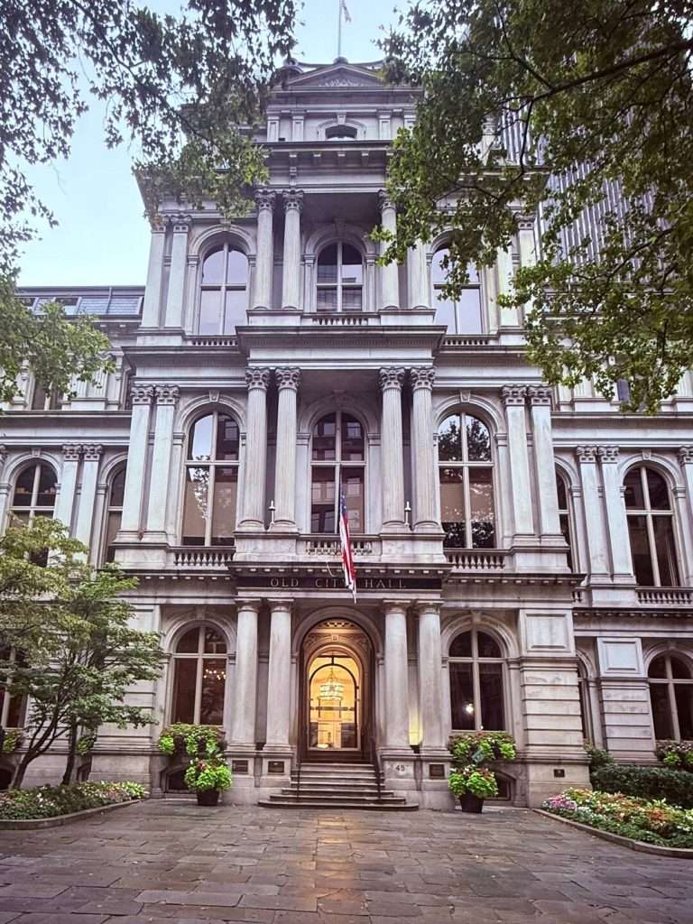 Historic building with large columns and courtyard.