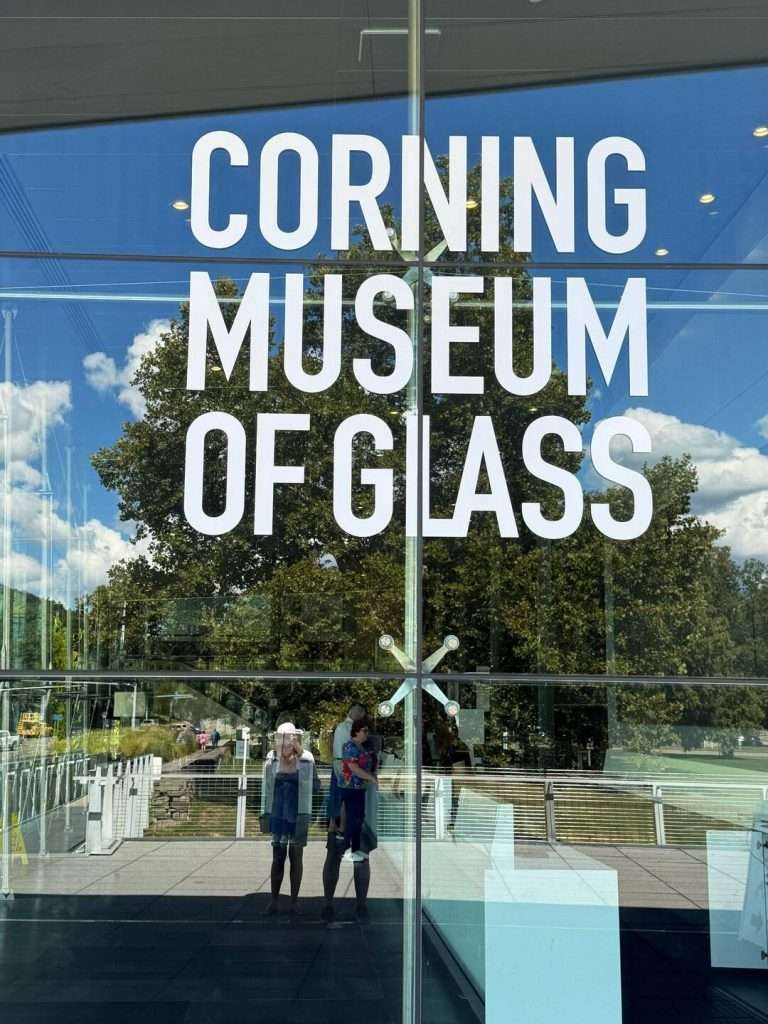 Entrance of Corning Museum of Glass with reflections.