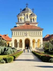 Historic cathedral with garden and blue sky