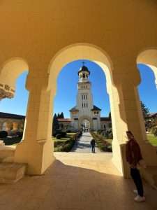 Historic Orthodox church with tower and archway view.