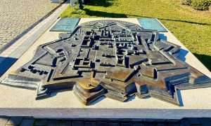 Bronze model of historic fortress layout.