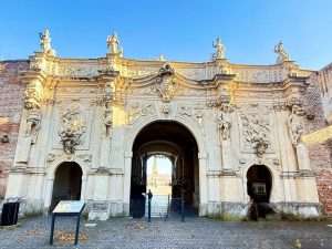 Historic ornate gateway with sculptures and carvings.