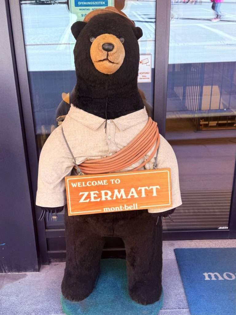 Stuffed bear holding Welcome to Zermatt sign