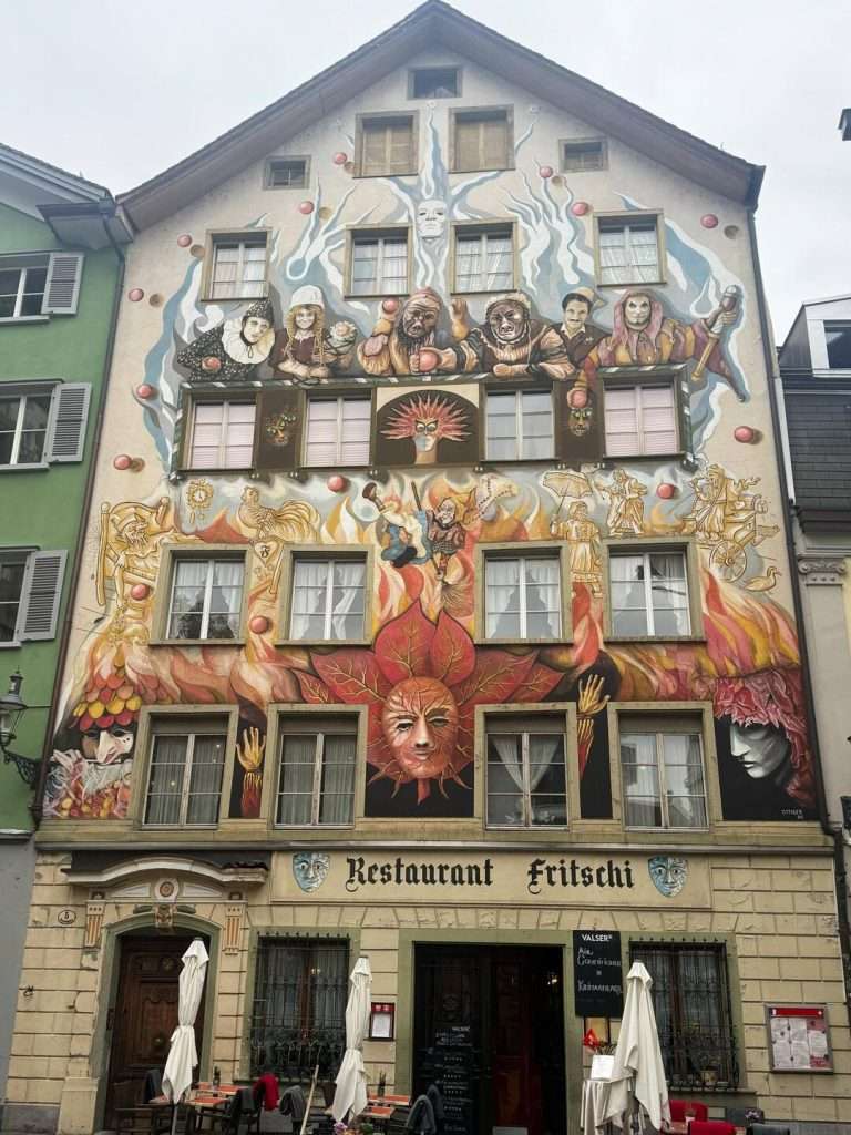 Colorful mural on Restaurant Fritschi building facade.