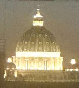 Dome of St. Peter's Basilica at night.