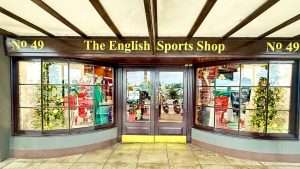 English Sports Shop facade with holiday decorations.