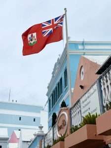 Bermuda flag above colorful buildings