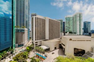 Miami Convention Center with surrounding skyscrapers.