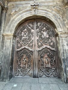 Ornate church wooden doors with intricate carvings