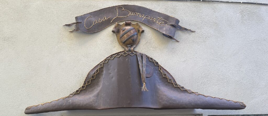 Casa Buonaparte metal sign with emblem and banner.