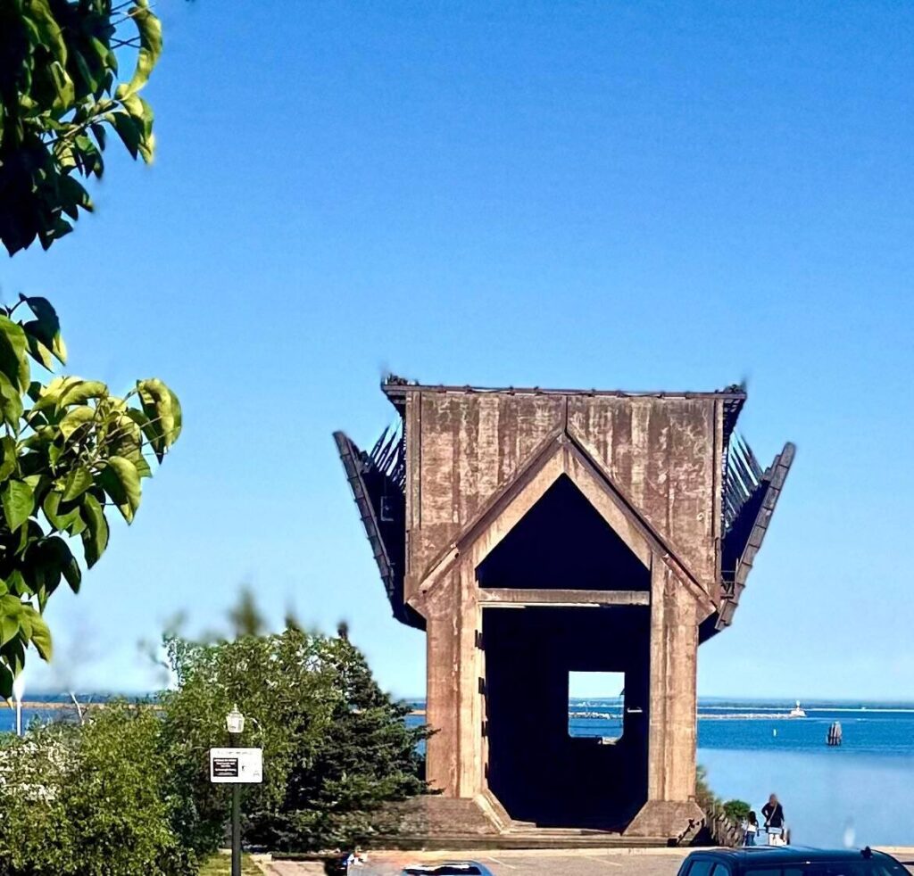 Old ore dock overlooking Lake Superior, blue sky.