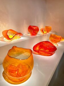 Colorful blown glass art pieces on display