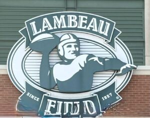 Lambeau Field sign with football player illustration.