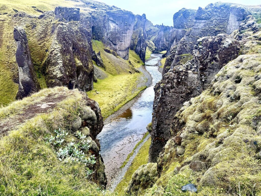 Scenic gorge with river and rocky cliffs.